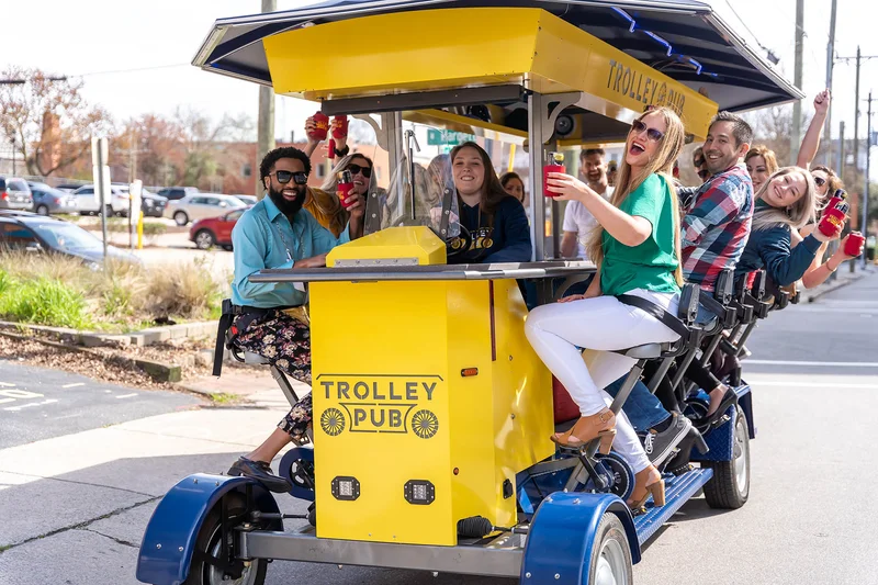 Guests riding the Trolley Pub