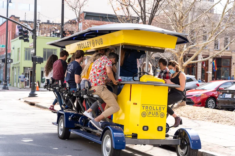 Guests riding the Trolley Pub